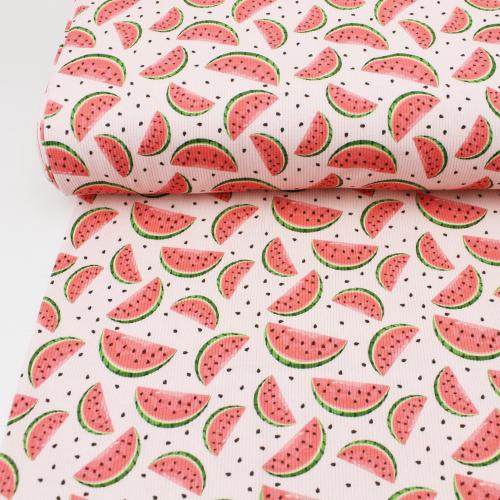 Gerippter Jersey mit Melonen auf einem Tisch fotografiert