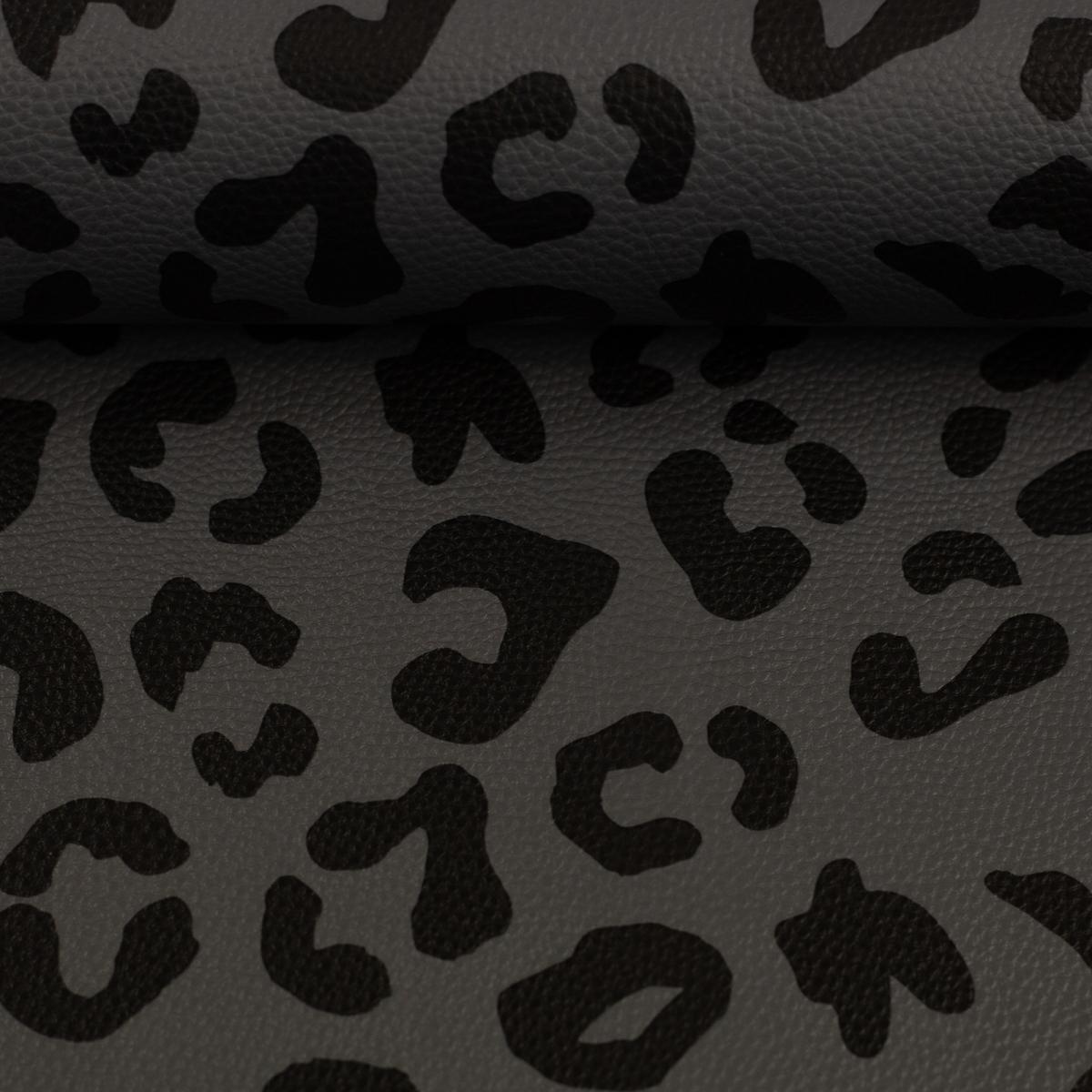 Kunstleder in schwarz grau auf einen Ballen gewickelt