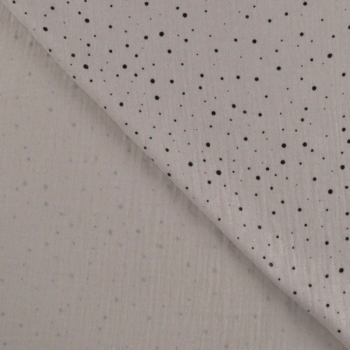 Musselin sandfarben mit schwarzen Punkten