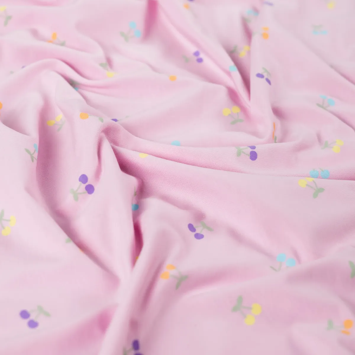 Stoff Jersey mit Kirschen rosa drapiert