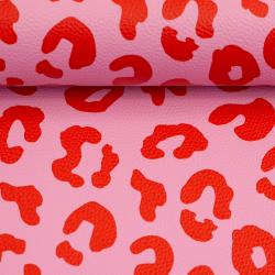 Kunstleder in rosa und rot auf einen Ballen gewickelt